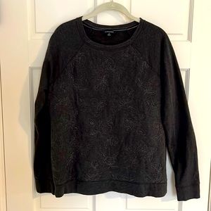 Charcoal grey sweatshirt with subtle floral embroidery. Lands’ End size 6-8.